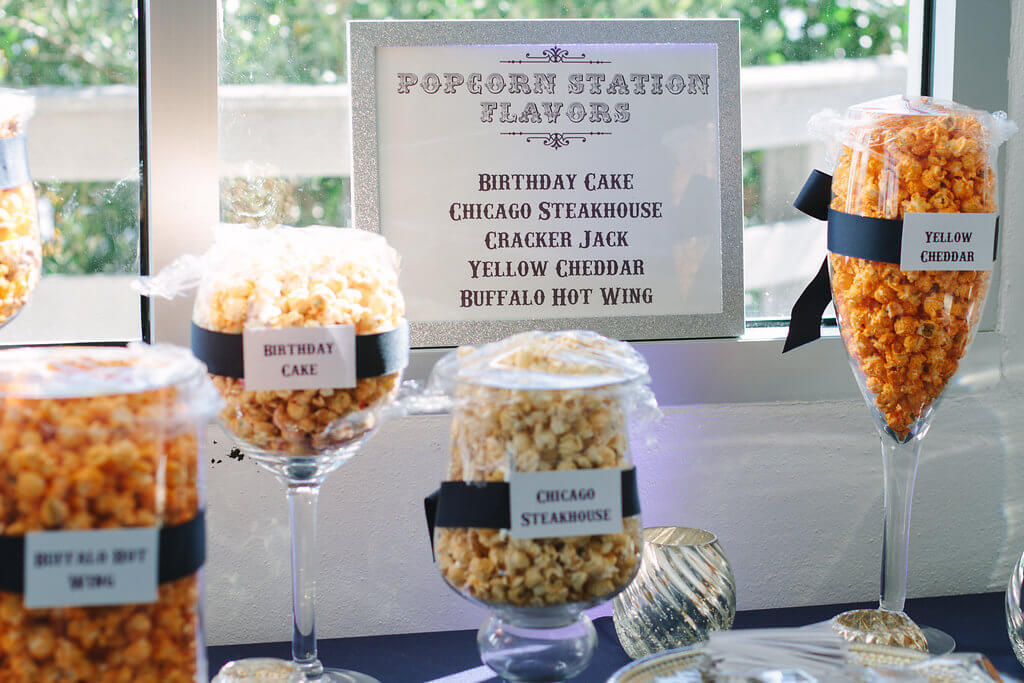 fun flavored popcorn in individual bags or as a buffet make for a great edible wedding favor