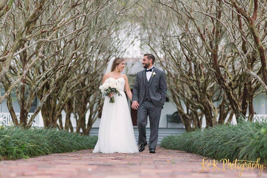 bride and groom walking hand in hand