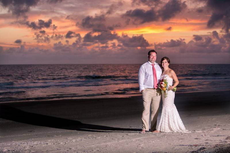 bride and groom at sunset