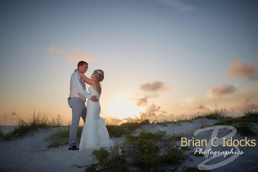 sunset on clearwater beach - clearwater beach sunset wedding - bride and groom at sunset- clearwater beach destination wedding at sunset