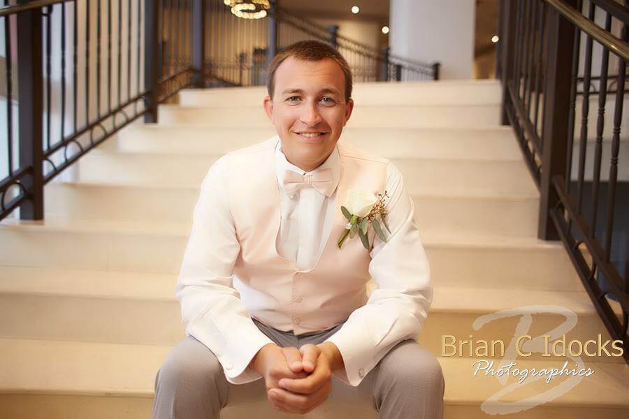 groom- groom waiting for bride- groom in pink vest and bow tie - groom in grey suit - clearwater beach wedding - destination wedding