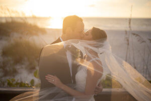 Special Moments Event Planning - bride and groom at sunset on Clearwater Beach - Carlouel Yacht and Country Club