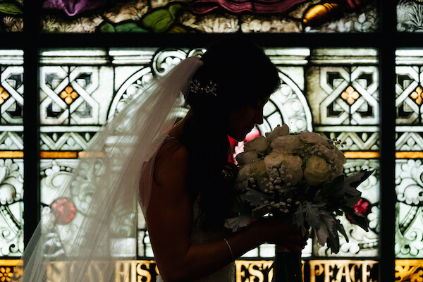 Tampa wedding – downtown Tampa wedding – Sacred Heart Tampa wedding – The Hip Room Wedding - Tampa Wedding planner - bride in front of stained glass window