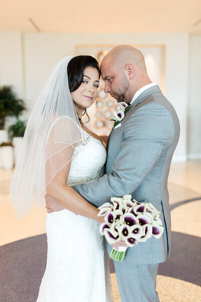 Opal Sands Wedding – Clearwater Beach Wedding – purple and white wedding-bride and groom