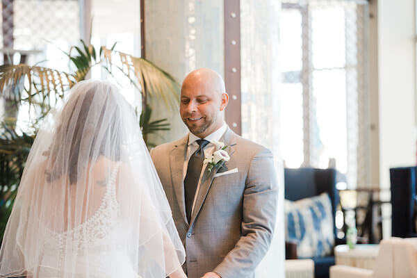 Opal Sands Wedding – Clearwater Beach Wedding – purple and white wedding-smiling groom