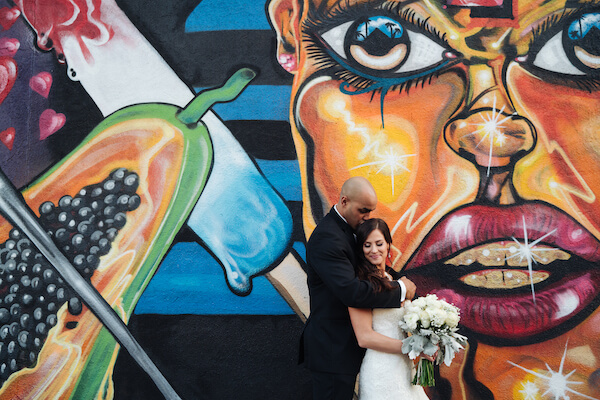 Tampa weddings – Tampa wedding planner – iconic Tampa wedding photos – Special Moments Event Planning - Tampa Murals - bride and groom in front of Tampa mural