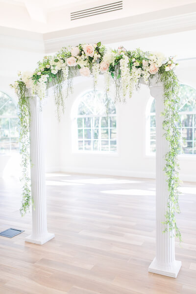 Harborside Chapel – Harborside Chapel wedding ceremony – Palm Harbor wedding – white wedding arch with pink and white flowers