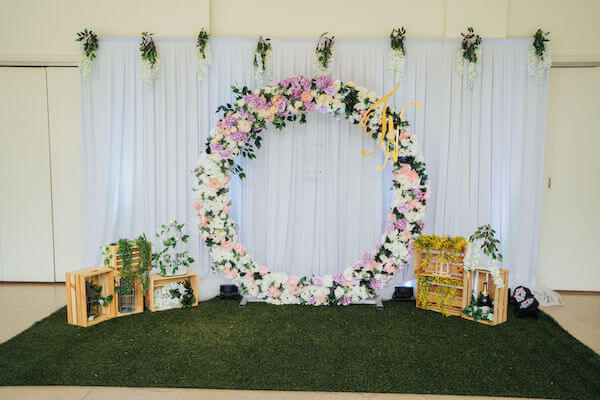 Tampa wedding planner- Special Moments Event Planning – Tampa Garden Club wedding - round floral photo backdrop