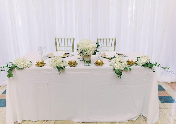 white draping - sweetheart table - St Petersburg wedding reception - St Petersburg wedding planner - Poynter Institute for Media Studies