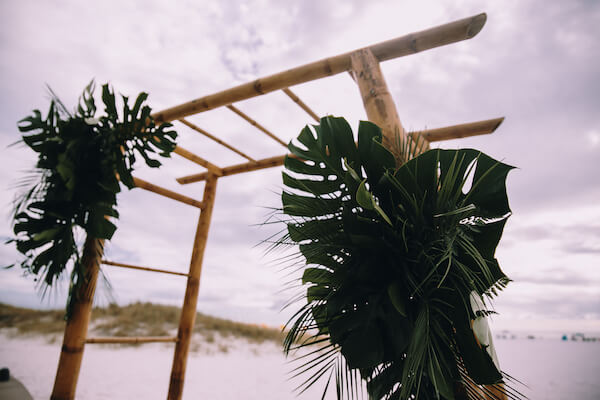 Special Moments Event Planning – Clearwater Beach Wedding – Clearwater Beach Wedding Planner- Clearwater Beach Destination Wedding- beach wedding ceremony - bamboo wedding arch - tropical wedding arch - wedding arch with palms - wedding arch with monstera leaves