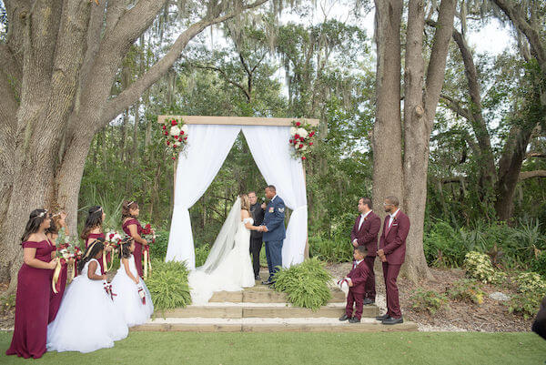 Special Moments Event Planning - Tampa Bay wedding - Secret Garden Wedding - 911 wedding - Military couple - bride and groom - outdoor wedding ceremony - red white and blue wedding - wedding vows