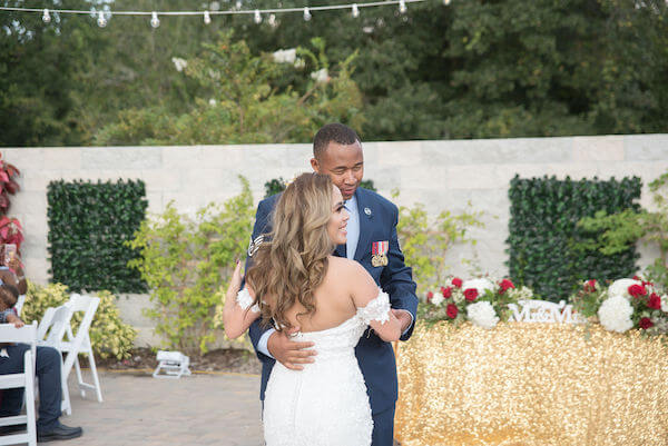 Special Moments Event Planning - Tampa Bay wedding - Secret Garden Wedding - 911 wedding - Military couple - bride and groom - Groom in Air Force uniform - first dance - red, white and blue wedding, gold sparkle sweetheart table - Mr + Mrs