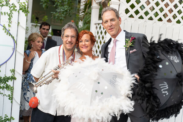 Special Moments Event Planning - second line - wedding parasol - st Petersburg wedding - st Petersburg wedding planner - unique wedding details - New Orleans jazz - buck jumping - trumpet - first line - bride and groom