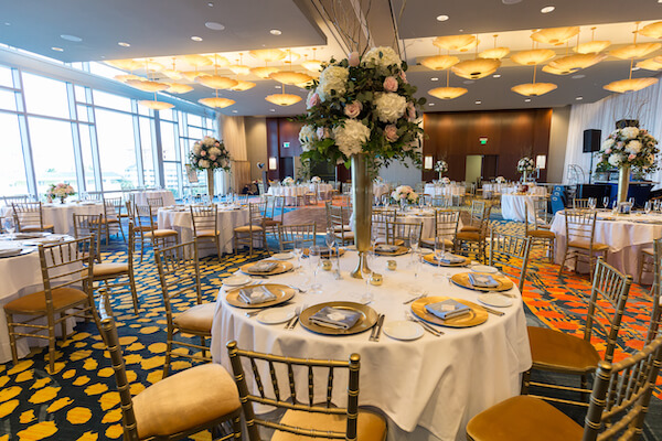 Clearwater Beach Wedding – Opal Sands Wedding – Special Moments Event Planning - gold chivari chairs- gold charger plates - pink and white centerpieces - Opal Sands wedding reception