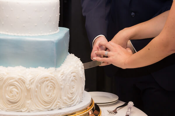 Clearwater Beach Wedding – Opal Sands Wedding – Special Moments Event Planning - wedding cake- bride and groom cutting wedding cake - cake cutting - 