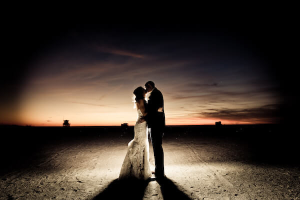 Clearwater Beach Wedding – Opal Sands Wedding – Special Moments Event Planning - bride and groom kissing - bride and groom on beach - sunset kiss on Clearwater Beach