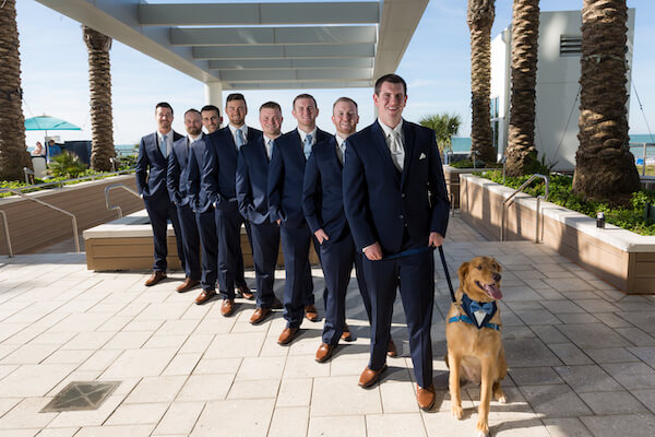 Clearwater Beach Wedding – Opal Sands Wedding – Special Moments Event Planning - groom - wedding party- groom with groomsmen - wedding party in Navy blue suits- groom with dog- including a dog in your wedding - dog with navy blue suit - wedding party with dog