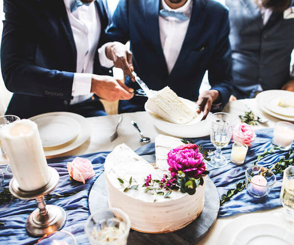 Same Sex Couple Cutting wedding Cake - LGBTQ weddings - cake cutting tips - when to cut your wedding cake