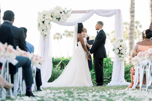 Rochelle and Che's wedding - bride and groom - Ritz Carlton - Ritz Carlton wedding - Ritz Carlton Sarasota - Ritz Carlton Sarasota wedding - Sarasota wedding - Sarasota black tie wedding - outdoor wedding ceremony - exchanging wedding vows