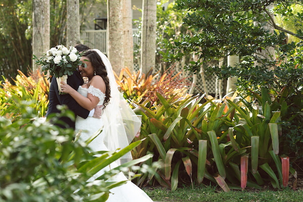 First Look – Bradenton wedding – Palma Sola Botanical Park wedding – Special Moments Event Planning - bride and groom embracing