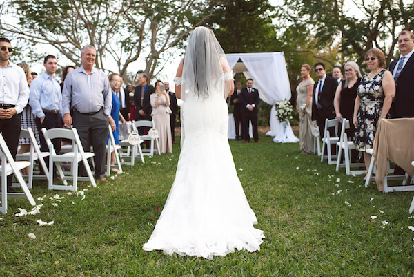 First Look – Bradenton wedding – Palma Sola Botanical Park wedding – Special Moments Event Planning - groom looking at bride walking down the aisle – bride walking down the aisle