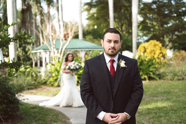 First Look – Bradenton wedding – Palma Sola Botanical Park wedding – Special Moments Event Planning - bride walking up behind groom