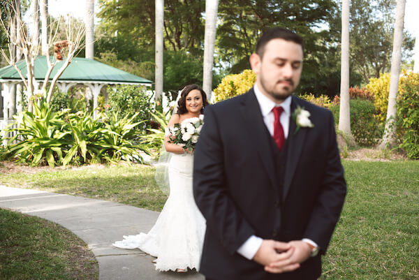 First Look – Bradenton wedding – Palma Sola Botanical Park wedding – Special Moments Event Planning - bride walking up behind groom