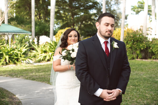 First Look – Bradenton wedding – Palma Sola Botanical Park wedding – Special Moments Event Planning - bride walking up behind groom