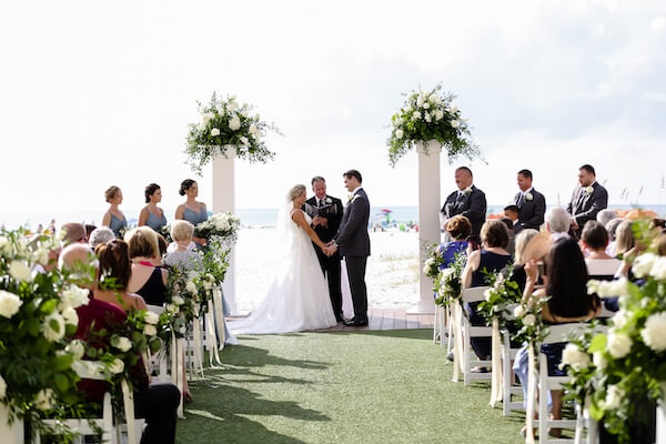 Sandpearl Resort – Sandpearl Wedding – Clearwater Beach Wedding – Greek wedding – Clearwater Beach wedding planner – Special Moments Event Planning - bride and groom - exchanging wedding vows - outdoor wedding ceremony at the Sandpearl resort