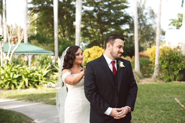 First Look – Bradenton wedding – Palma Sola Botanical Park wedding – Special Moments Event Planning - bride walking up behind groom - bride tapping groom on shoulder