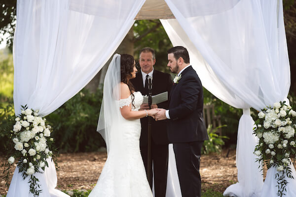 Bradenton wedding – Palma Sola Botanical Park wedding - Special Moments Event Planning - bride - groom - bride and groom exchanging wedding vows- chuppah