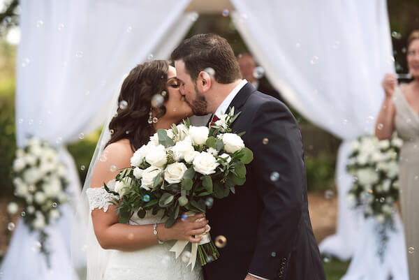 Bradenton wedding – Palma Sola Botanical Park wedding - Special Moments Event Planning - bride - groom - bride with white bouquet - first kiss - just married