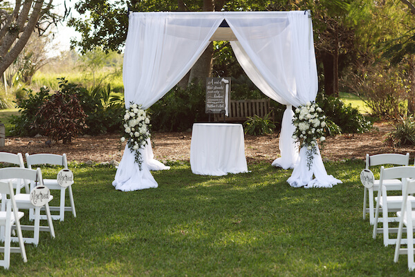 Bradenton wedding – Palma Sola Botanical Park wedding - Special Moments Event Planning - outdoor wedding ceremony - garden wedding ceremony - chuppah - chuppah with white flowers- multicultural wedding ceremony