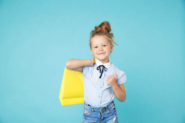 little girl at a wedding with an age appropru=iate activity bag - including children in your wedding