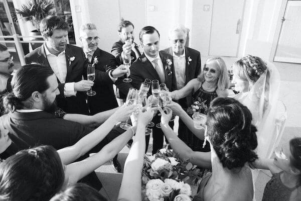 Special moments Event Planning x- Clearwater Beach wedding - Clearwater Beach wedding planner - Sandpearl Resort wedding - bride and groom toast with wedding party