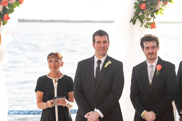 Clearwater Beach Wedding - Holiday inn and Suite Clearwater beach - Special Moments Event Planning - outdoor wedding ceremony - waterfront wedding ceremony - groom waiting for his bride - anxious groom