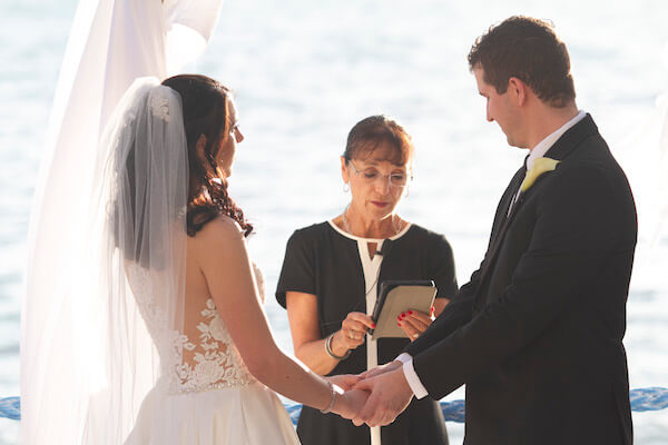 Clearwater Beach Wedding - Holiday inn and Suite Clearwater beach - Special Moments Event Planning - outdoor wedding ceremony - waterfront wedding ceremony. - bride - groom - bride and groom - bride and groom exchanging wedding vows