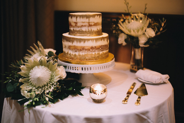 naked wedding cake - naked wedding cake with gold leaf - two tiered gold foiled wedding cake