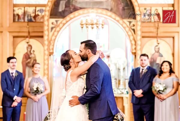 bride and groom kissing after a socially distant Greek Orthodox wedding in Tampa