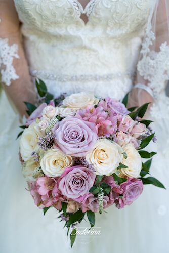 tampa bride holding her ivory, blush and lavender bridal bouquet