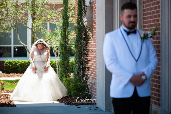 Tampa bride taking a deep breath before walking up for her first look with her groom