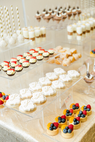 bite sized desserts on clear lucite risers