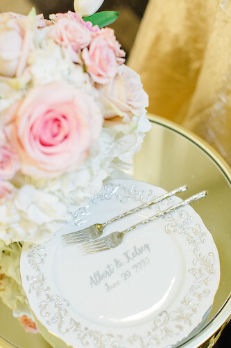 vintage inspired cake plate with bride and grooms names along side Mr. and Mrs. forks