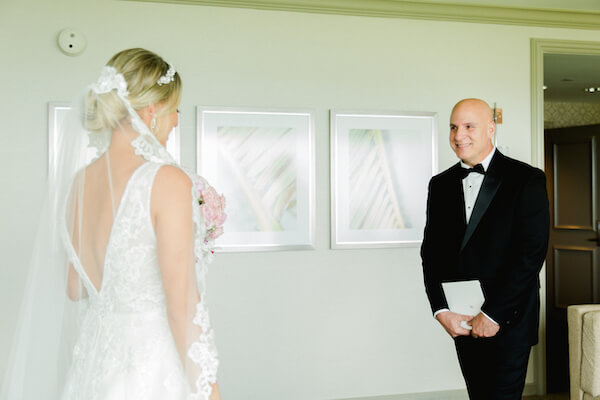 bride having a first look with her father