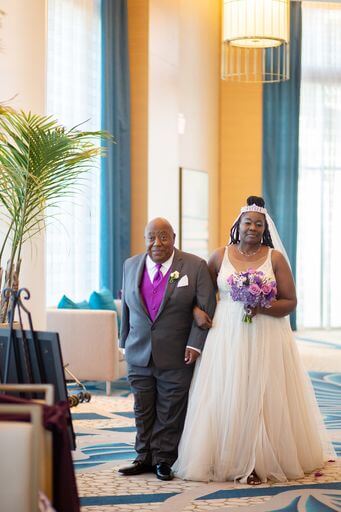 bride making her entrance escorted by her father