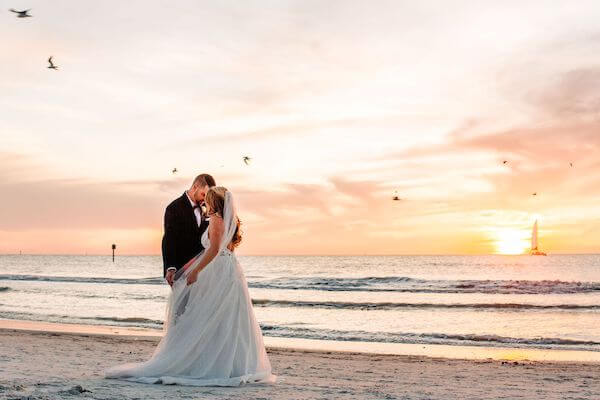 bride and groom at sunset on Clearwater Beach