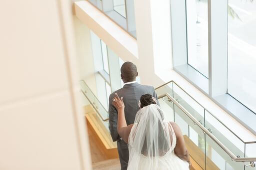 Bride walking up behind her groom to be and tapping him on the shoulder