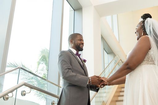 bride and groom holding hands after their first look