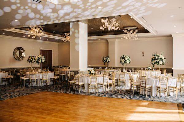 gold and white reception decor at the Bellaire Ballroom at the Hyatt Clearwater Beach