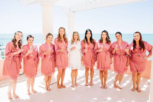 bride with her bridal party sipping champagne at the Hyatt Clearwater beach